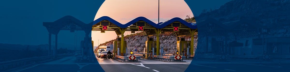 A colorful toll gantry, with circle of color in the center of a blue overlay.